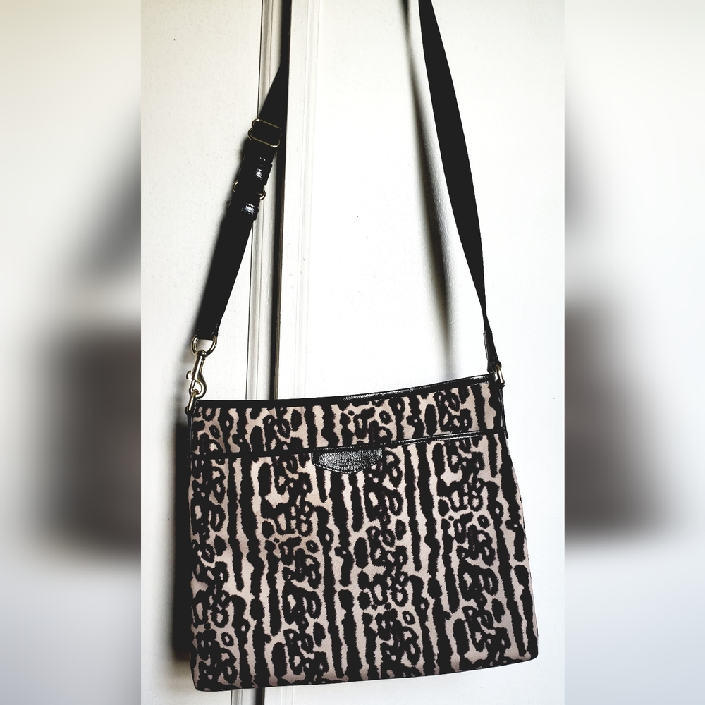 COACH canvas animal print crossbody bag.